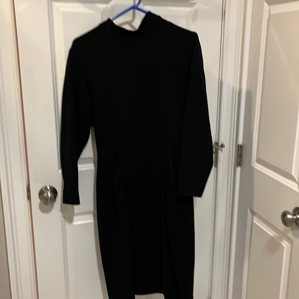 Nipon Boutique black wool dress with three buttons at neck and zipper up back.